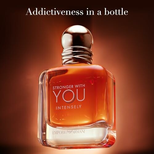 Emporio Armani perfume bottle with text 'Addictiveness in a bottle'.