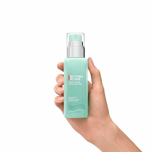 Hand holding Biotherm Homme AquaPower Advanced Gel bottle.