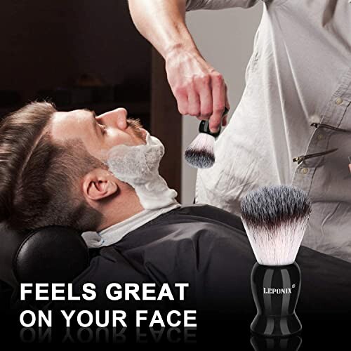 Man receiving a shave at barbershop with brush.