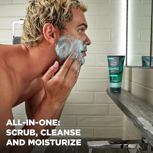 Man applying face scrub in bathroom