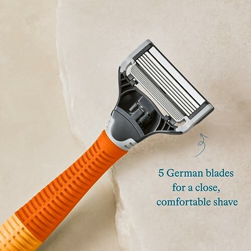 Orange razor with 5 German blades for a close shave.