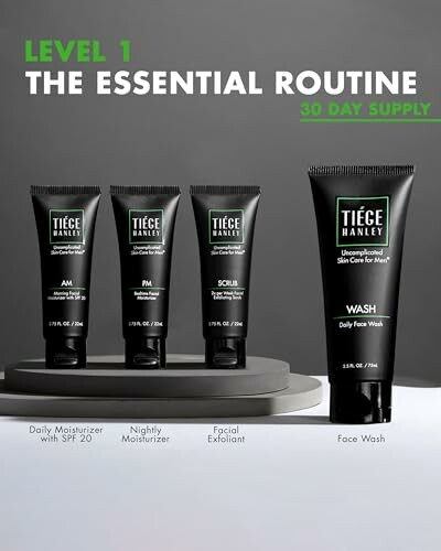 Tiege Hanley Level 1 Essential Routine skincare products including moisturizer, scrub, and face wash.